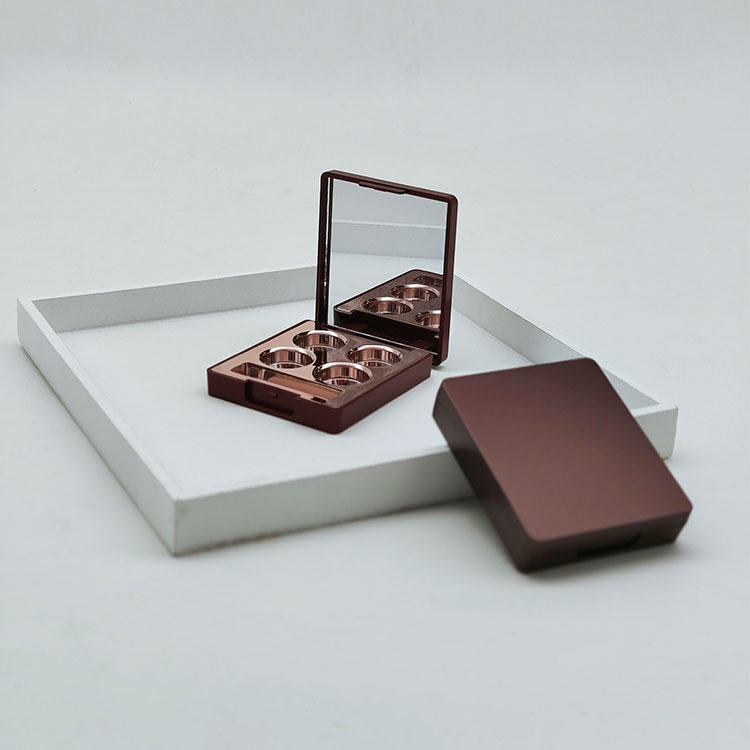 Y446 Gorgeous European 4-grid round hole eye shadow palette with mirror and brush